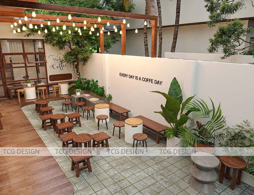 Thiết kế quán cafe sân vườn với đèn trang trí lung linh, tạo không gian lãng mạn và ấm cúng vào buổi tối.